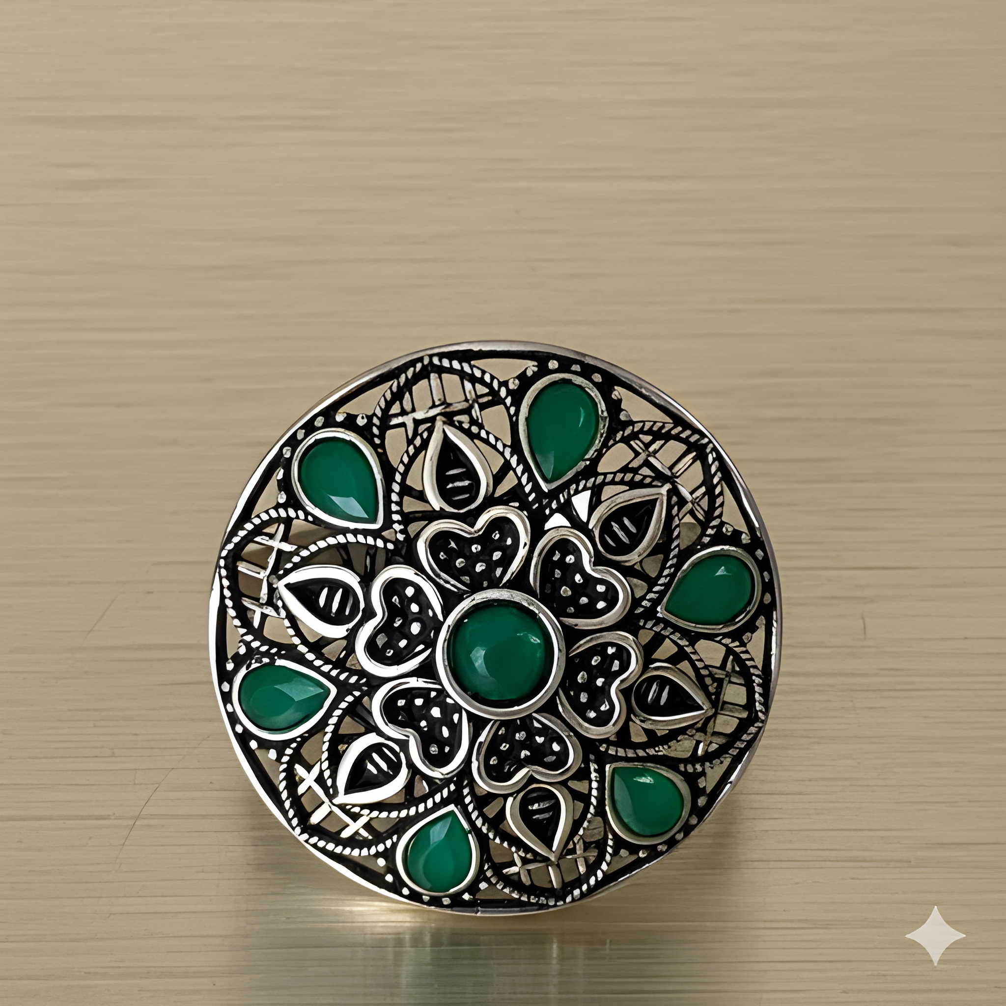 Handcrafted mandala stone ring displayed on golden background