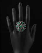 Handcrafted mandala stone statement ring with intricate detailing on black hand display