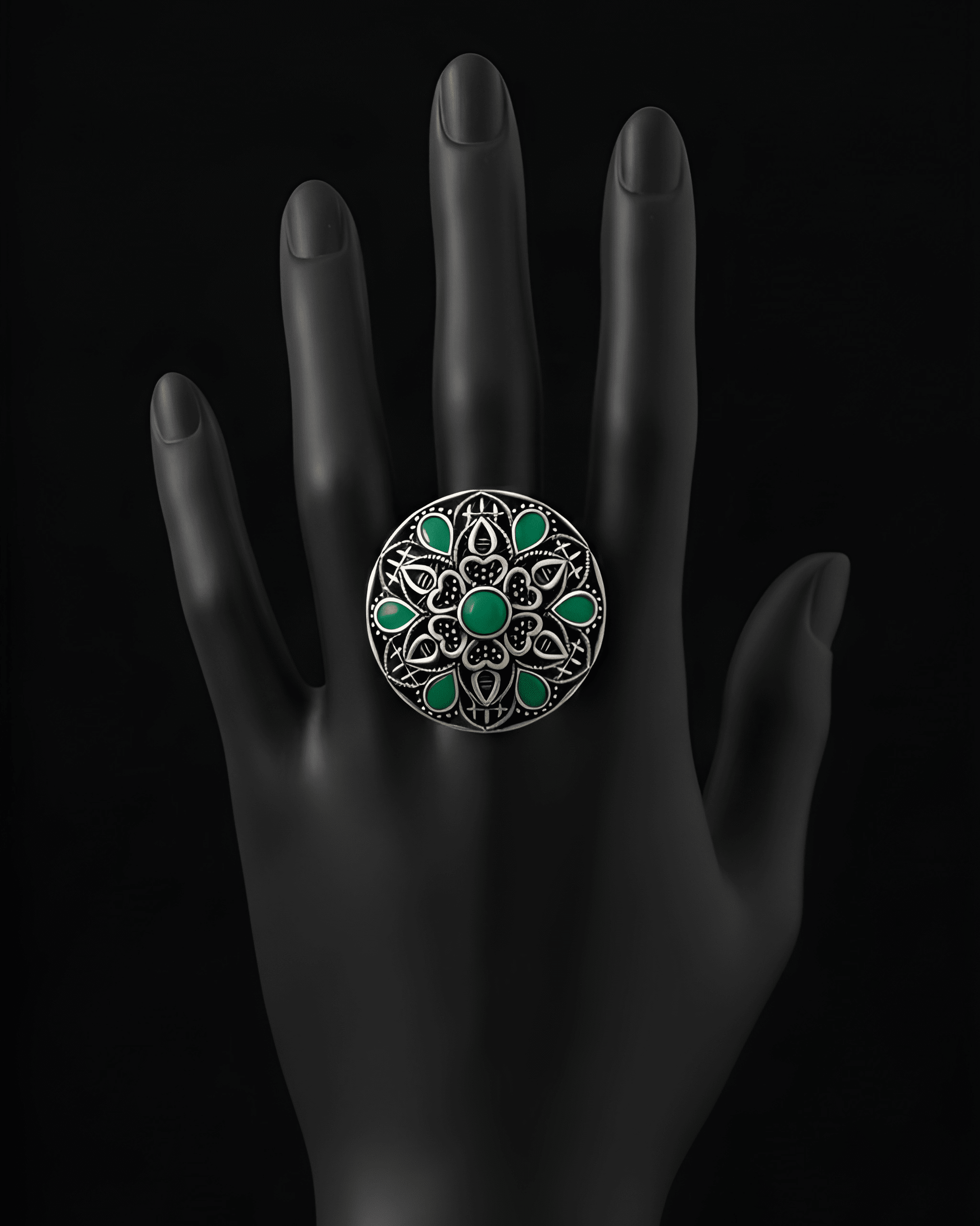 Handcrafted mandala stone statement ring with intricate detailing on black hand display