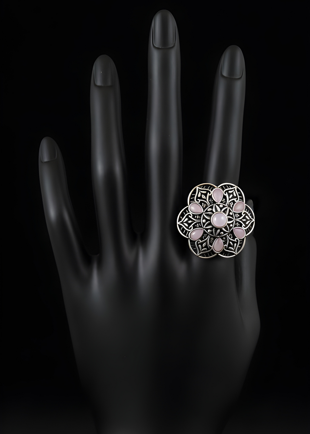 Handcrafted mandala stone statement ring with intricate detailing on black hand display