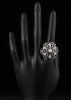 Handcrafted mandala stone statement ring with intricate detailing on black hand display