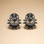 Ganesh stud earrings with oxidised silver finish and circular bead detailing

