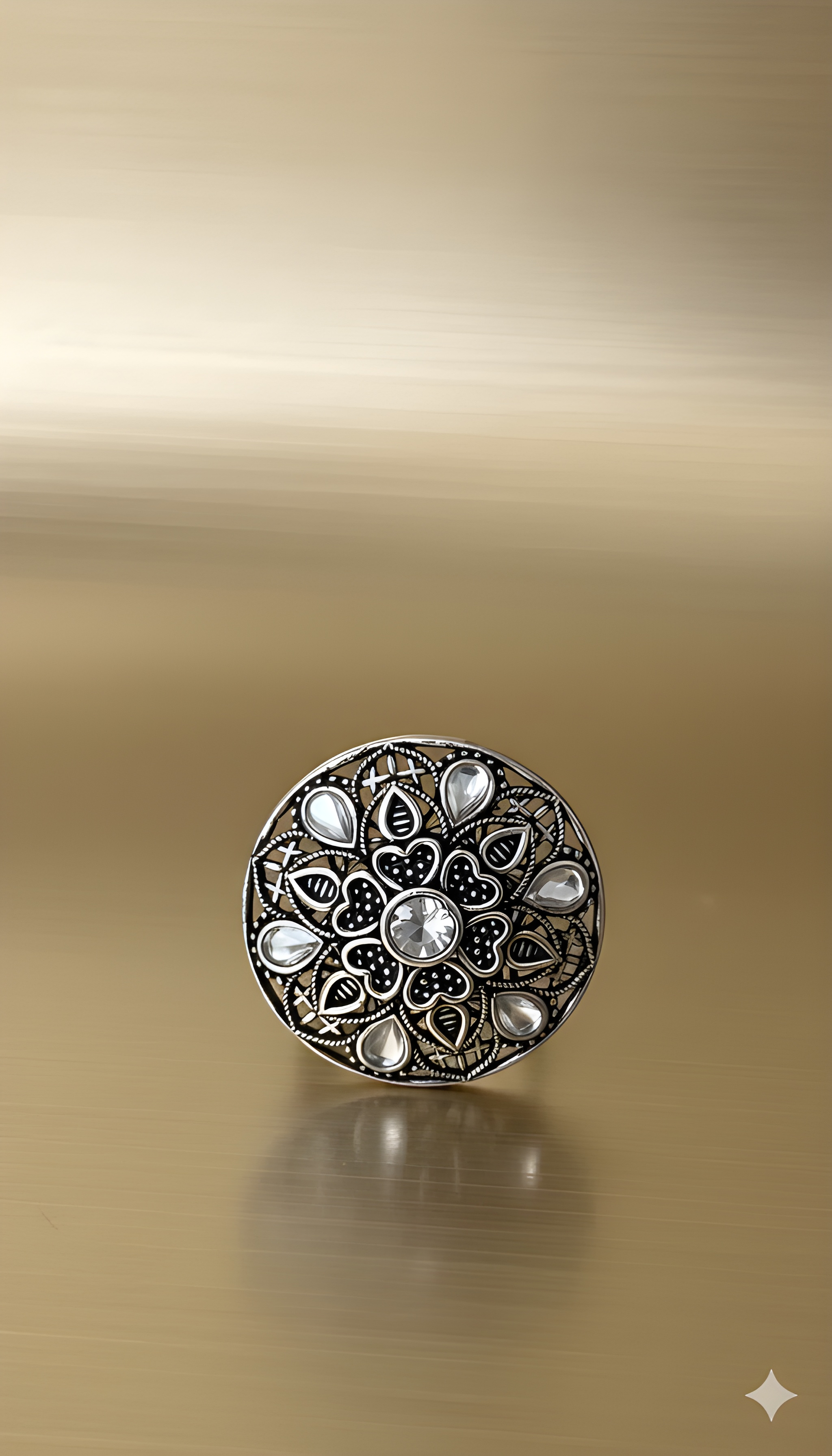 Handcrafted mandala stone ring displayed on golden background