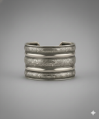 Close-up of intricate engraved craftsmanship on handcrafted oxidised silver cuff bracelet
