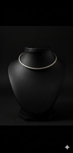 Detailed view of handcrafted oxidised silver hasli neckpiece displayed on bust stand
