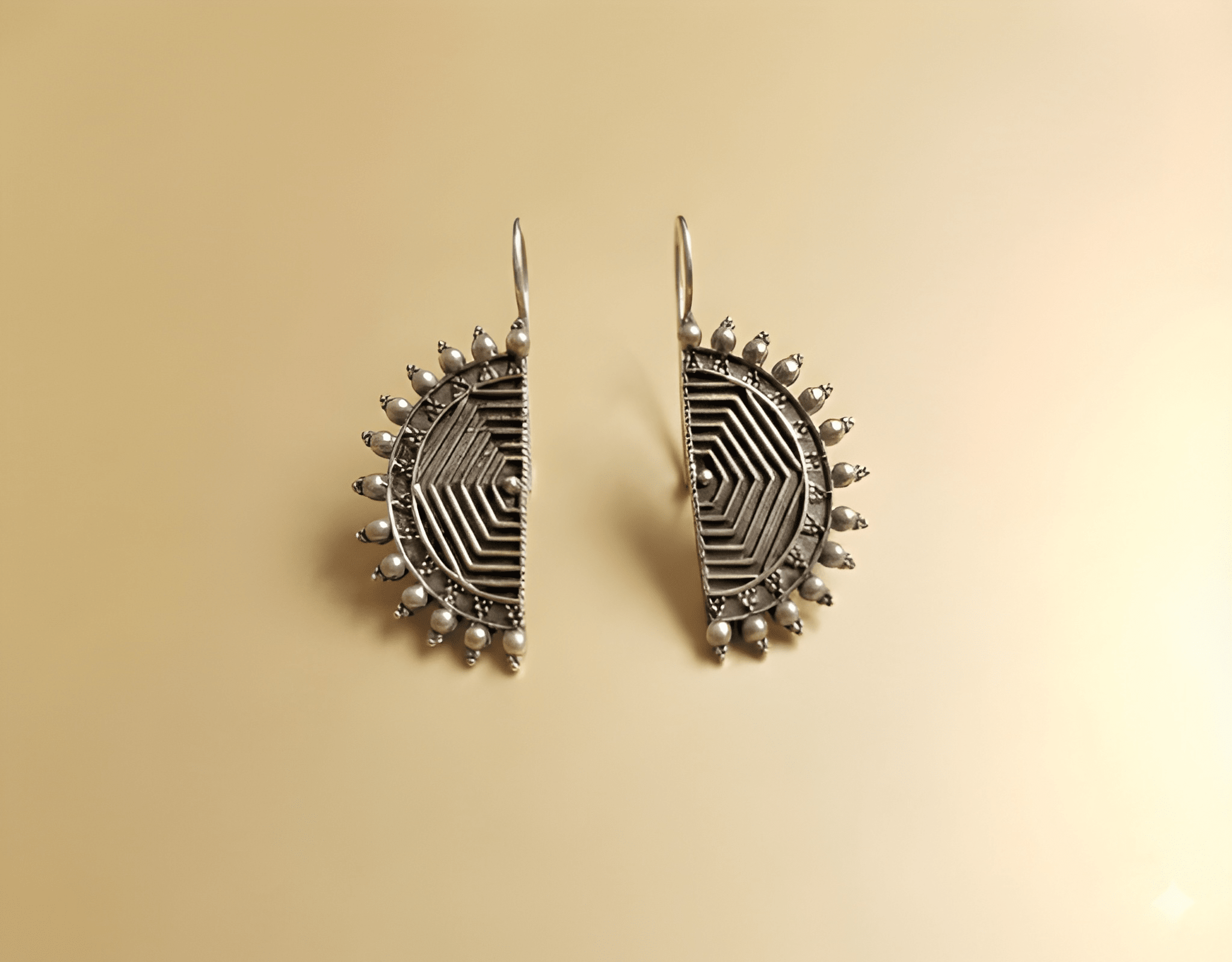 Half-moon maze oxidised earrings with geometric linework and beaded rim

