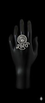 Handcrafted Shakti motif oxidised silver statement ring displayed on black hand