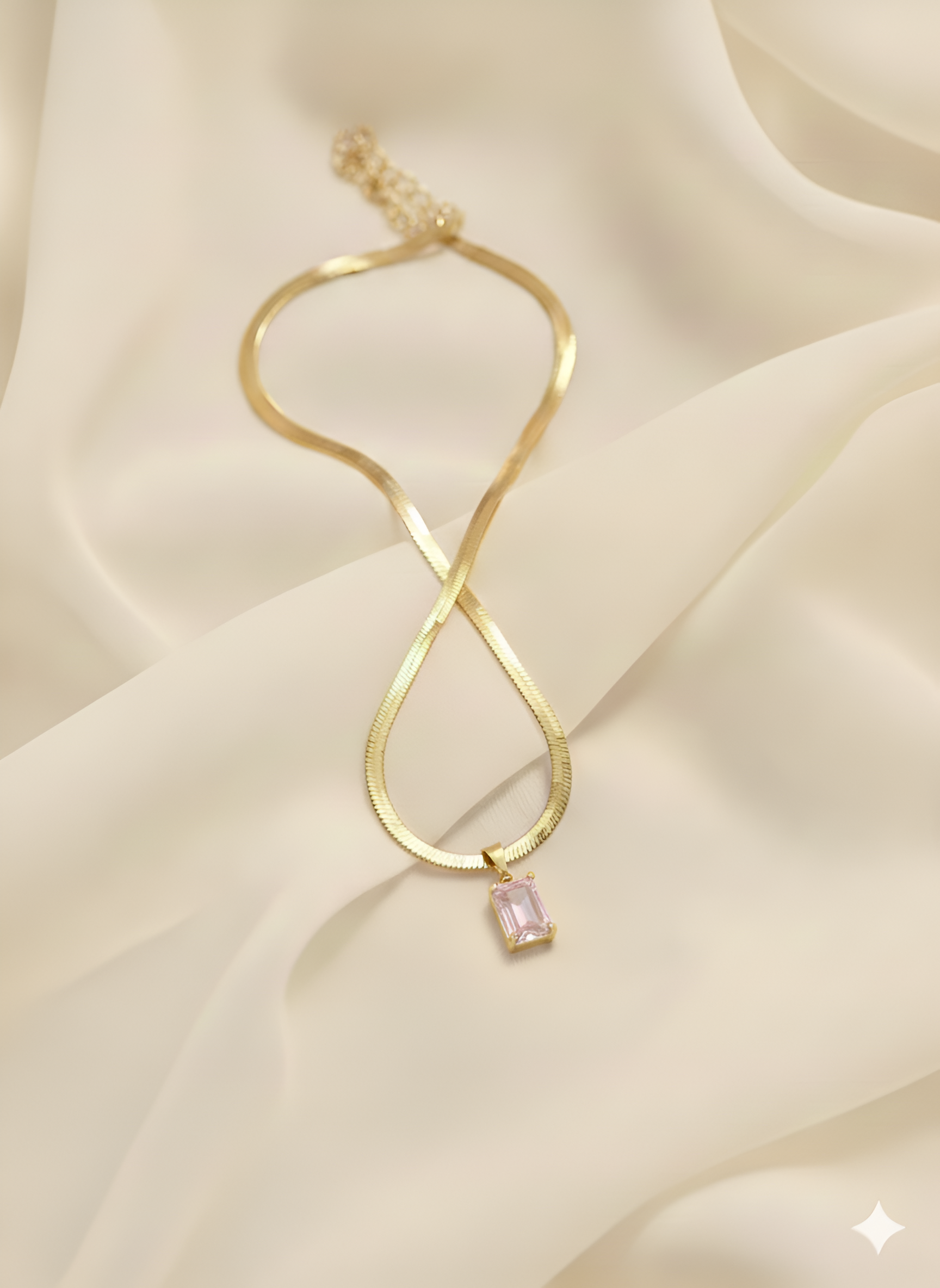 Gold rectangle clear crystal pendant necklace on ivory fabric