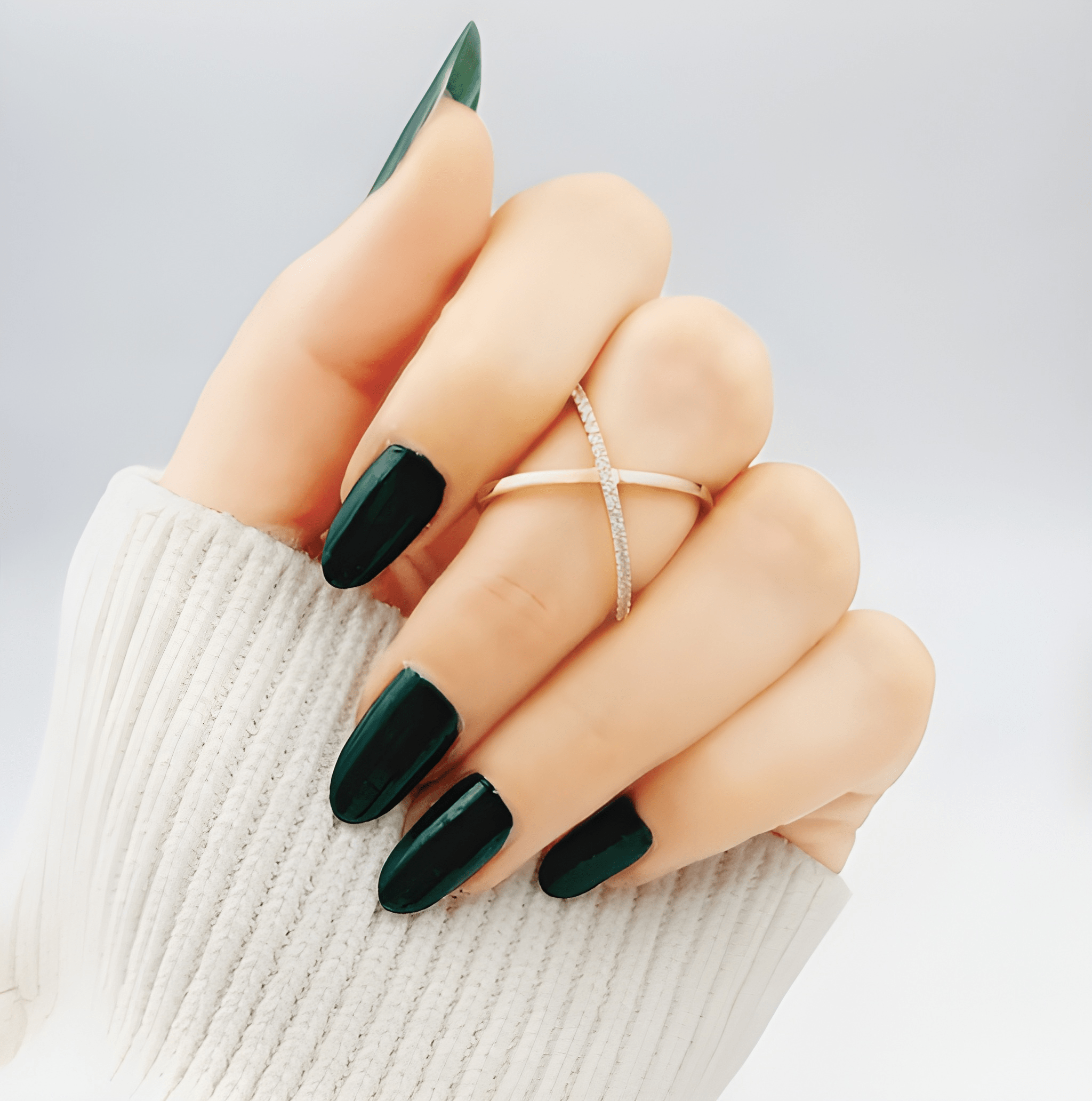 Slim X crossover crystal ring worn on woman's finger