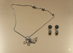 Close-up of oxidised silver Krishna pendant detailing on neckpiece